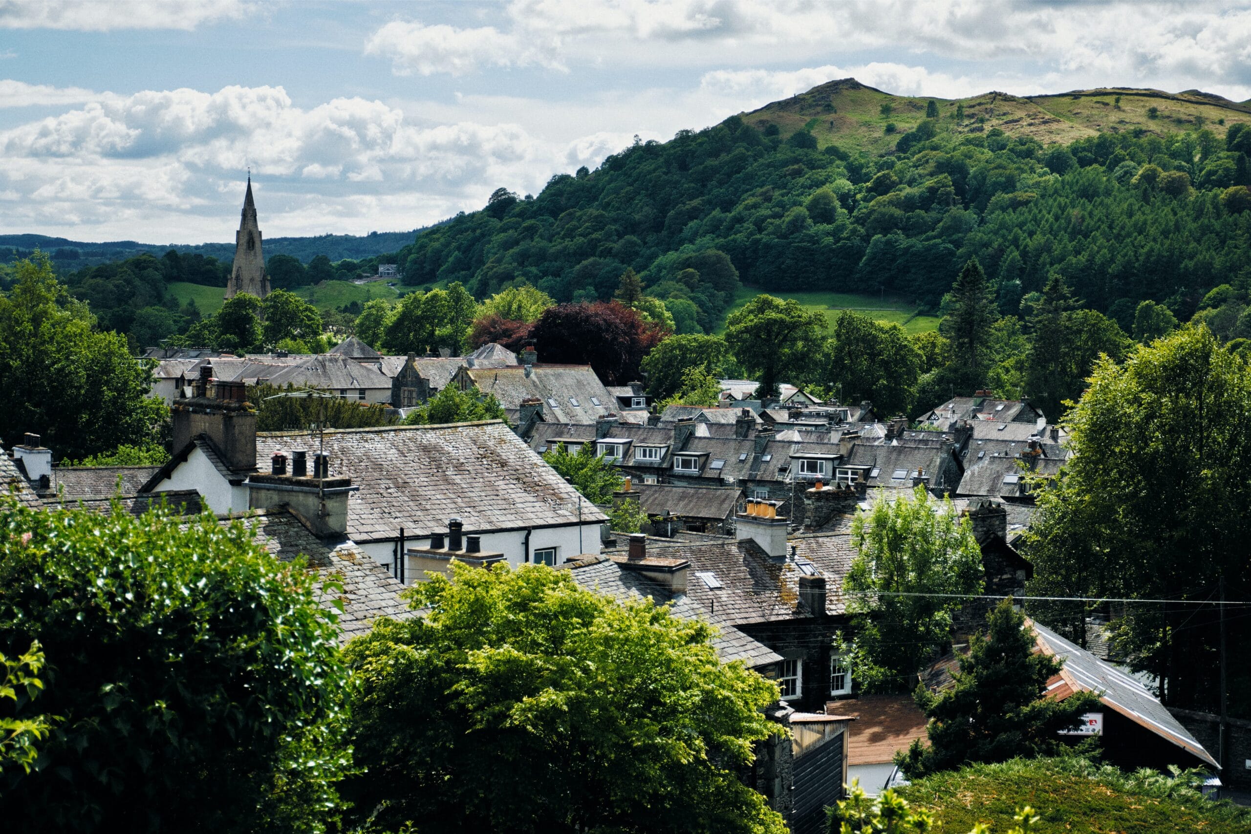 Rolling green fells under a dramatic Lake District sky