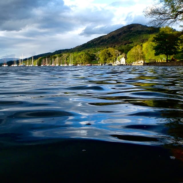 Dramatic clouds gathering over a Lake District lake and fells