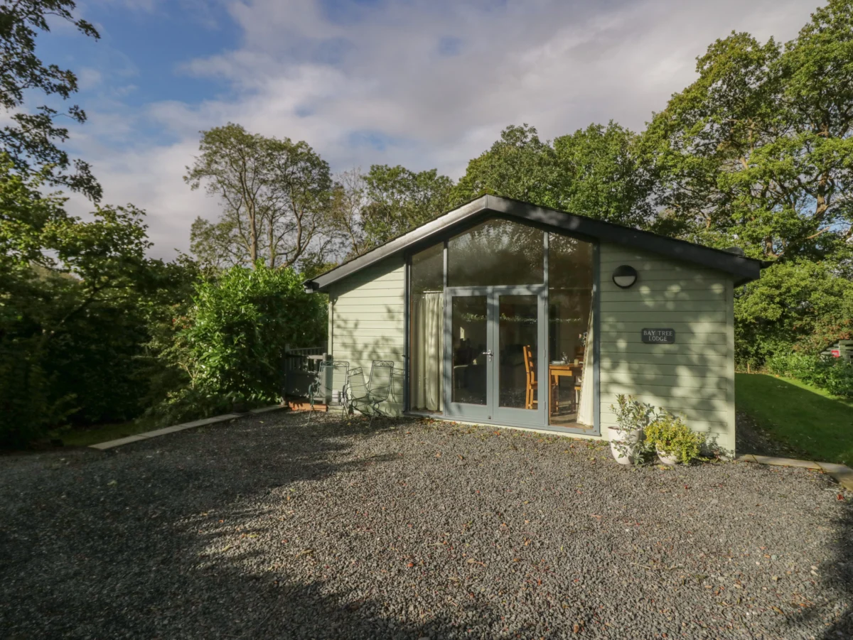 Bay Tree Lodge, Cartmel, Cumbria. Single-storey. Woodburning stove. Decking with furniture. Smart TV