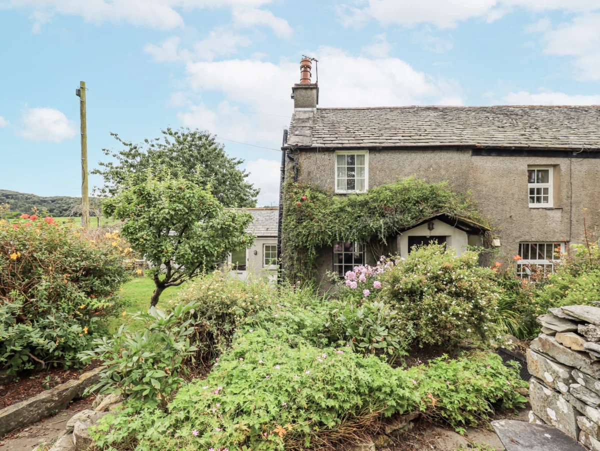 Old Cottage, charming 200-year-old cottage in Oxen Park, Cumbria, with a cast-iron woodburning stove